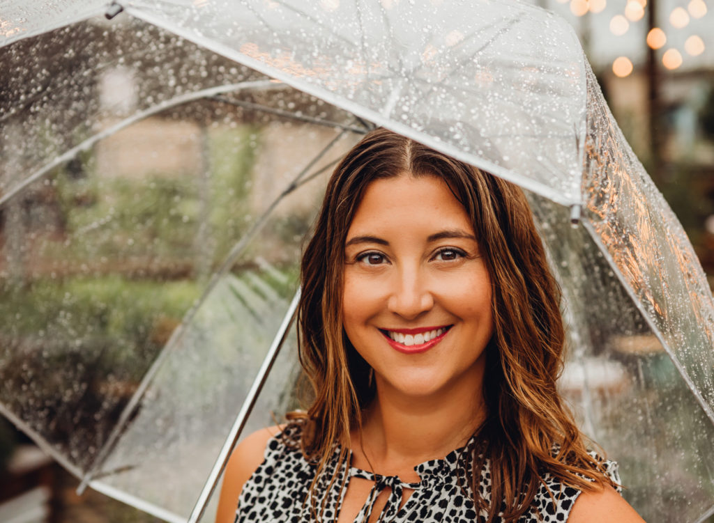 Woman smiling with umbrella