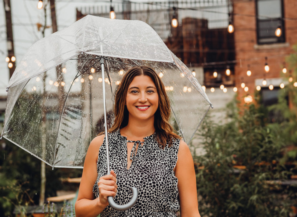 Woman smiling with umbrella
